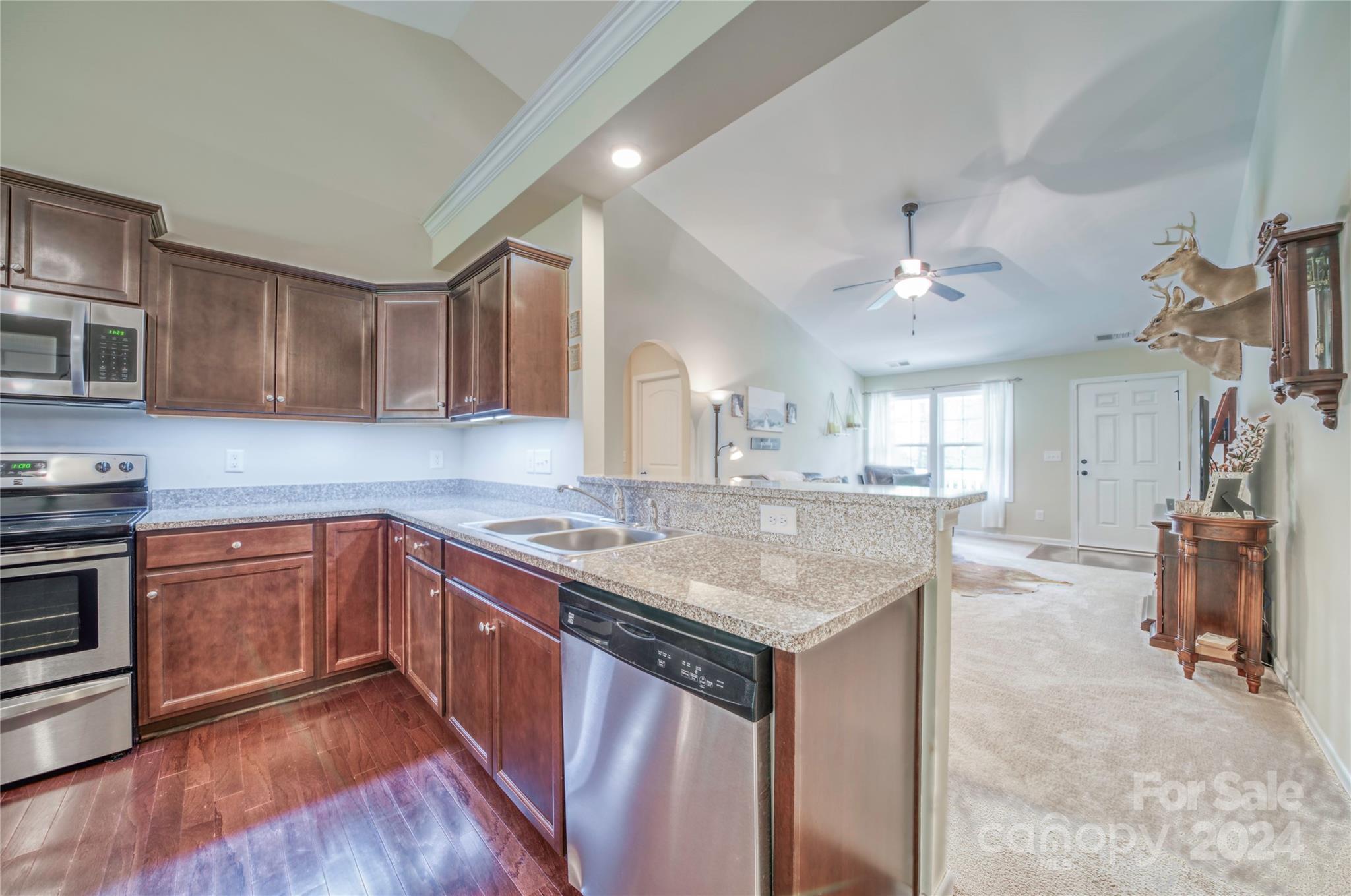 303 Reservation Road Catawba, SC 29704 - Photo 12 of 32 a kitchen with stainless steel appliances granite countertop a sink stove and refrigerator
