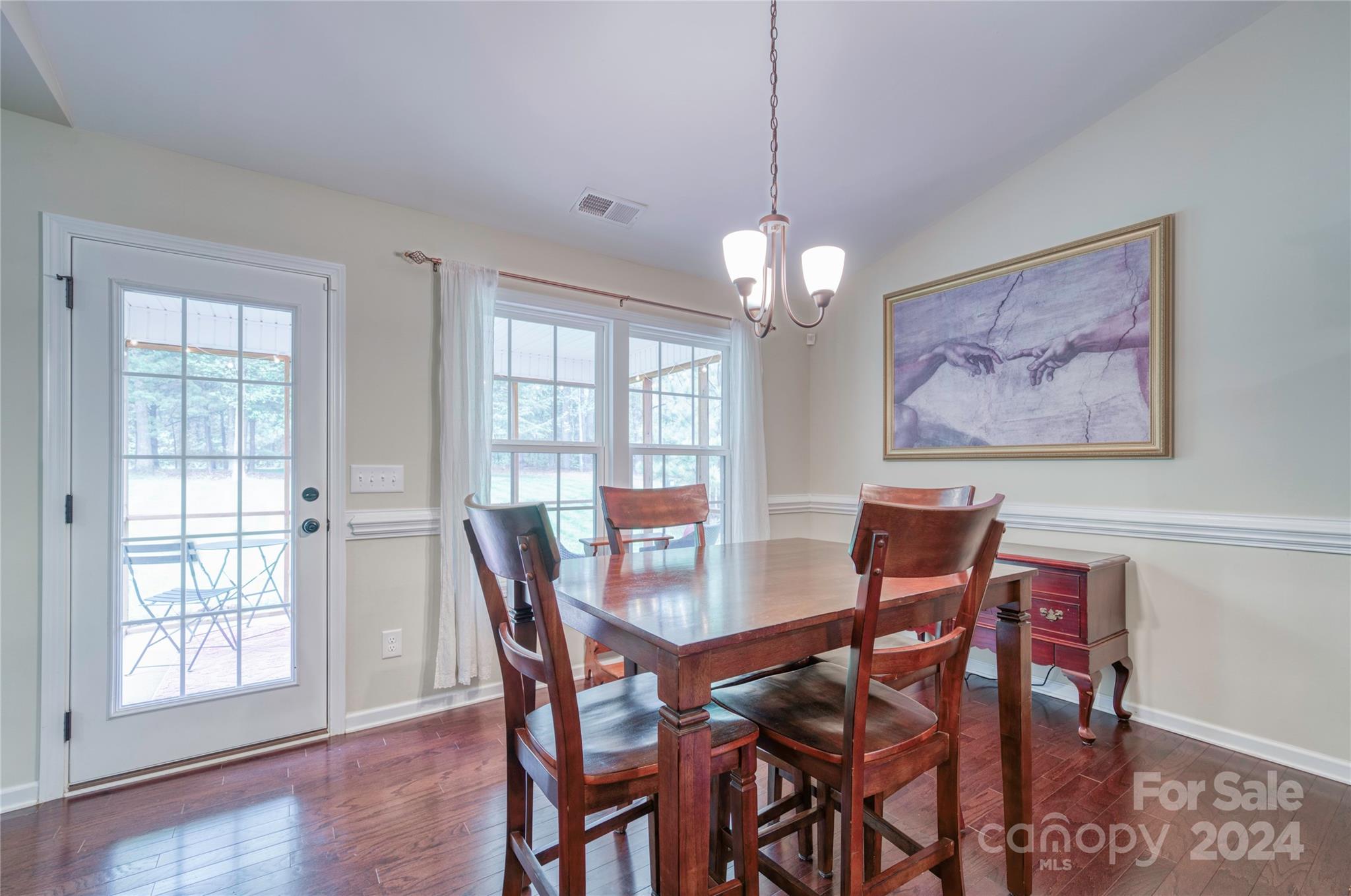 303 Reservation Road Catawba, SC 29704 - Photo 15 of 32 a view of a dining room with furniture wooden floor and chandelier