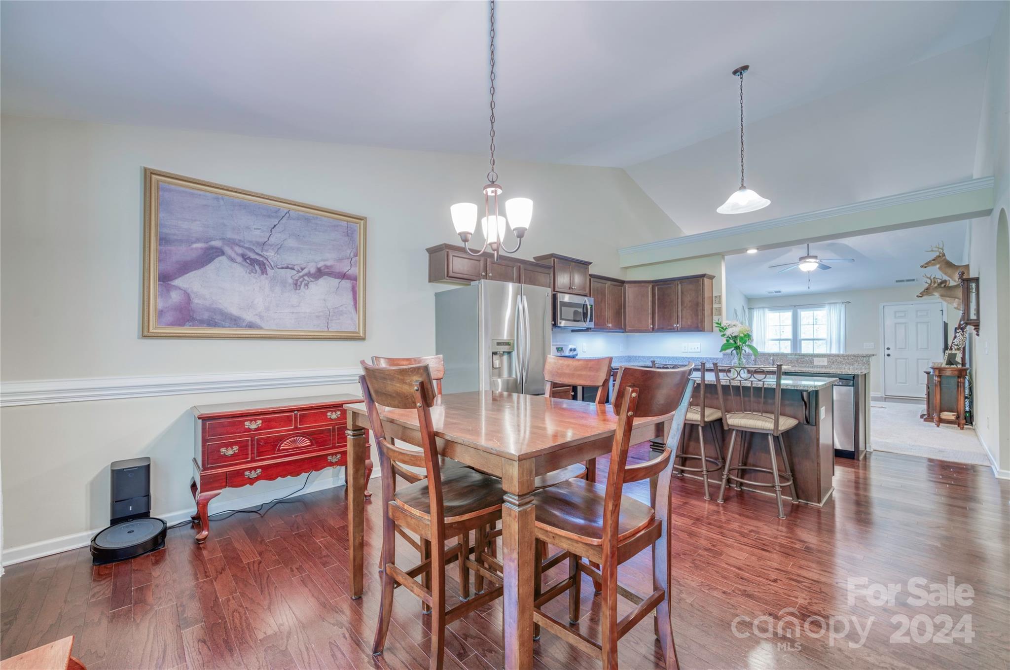 303 Reservation Road Catawba, SC 29704 - Photo 16 of 32 a view of a dining room with furniture wooden floor and chandelier