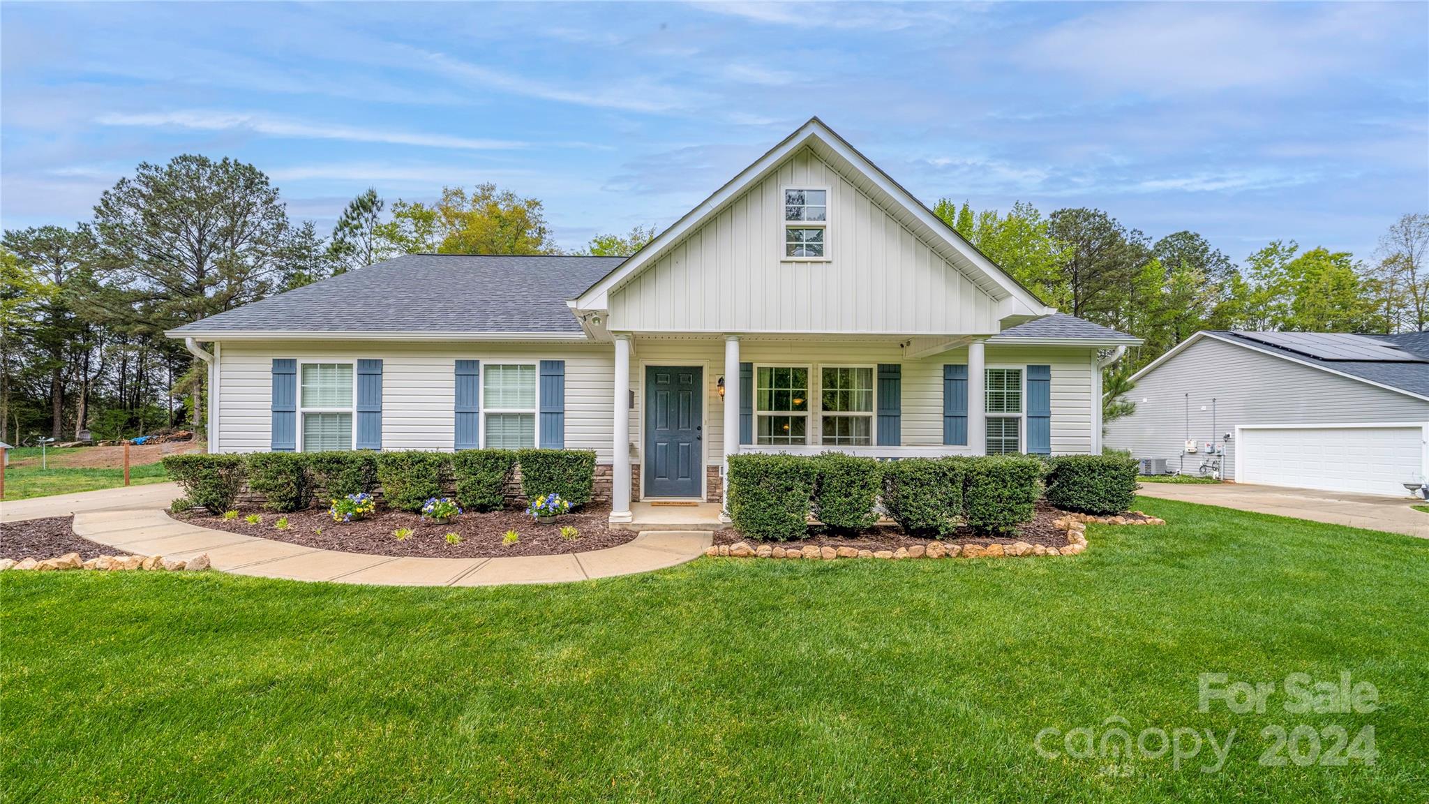 303 Reservation Road Catawba, SC 29704 - Photo 2 of 32 a front view of a house with a yard and outdoor seating