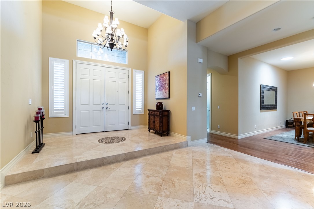3661 Riley Ann Avenue Las Vegas, NV 89139 - Photo 4 of 42 Grand double doors and soaring ceilings create an impressive welcome in this entry foyer.