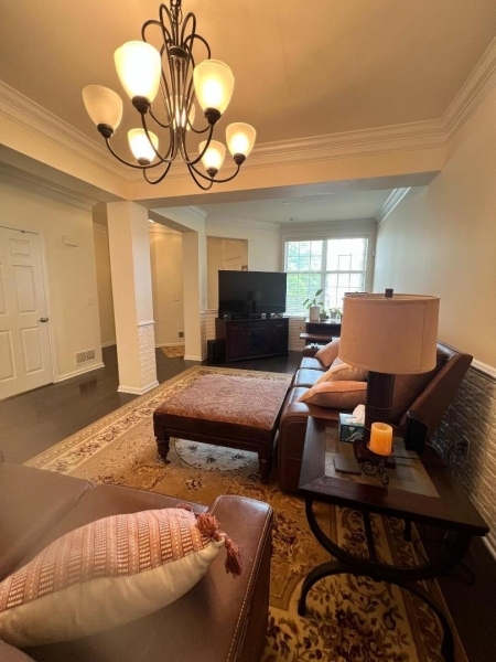 4 Greenwich Court Budd Lake, NJ 07828 - Photo 7 of 32 a bedroom with a bed and a chandelier