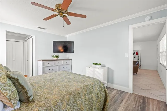a bathroom with a granite countertop toilet sink and mirror