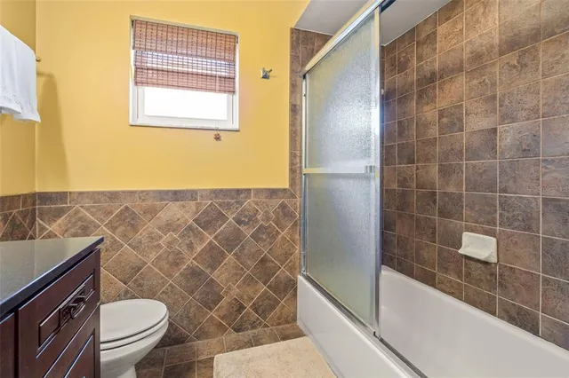 a bathroom with a sink a mirror and a toilet