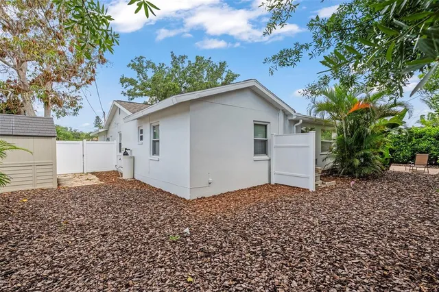 a house with a tree in front of it