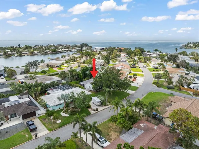 a backyard of a house with outdoor seating