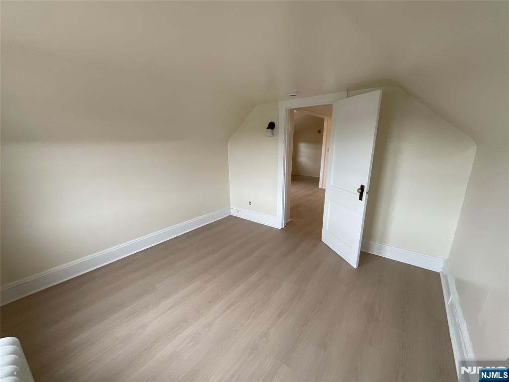 131 Delafield Avenue, Unit 3 Lyndhurst, NJ 07071 - Photo 13 of 15 wooden floor in an empty room