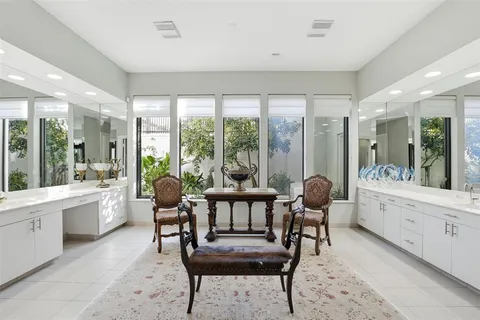 a bedroom with a bed a couch and dresser