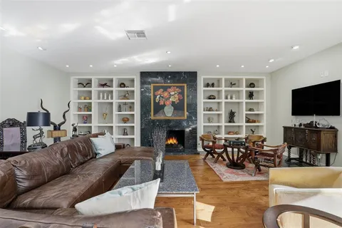 a view of a large room with furniture and window
