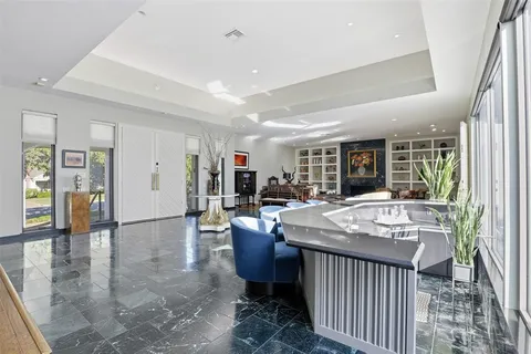 a dining room with a table and chairs