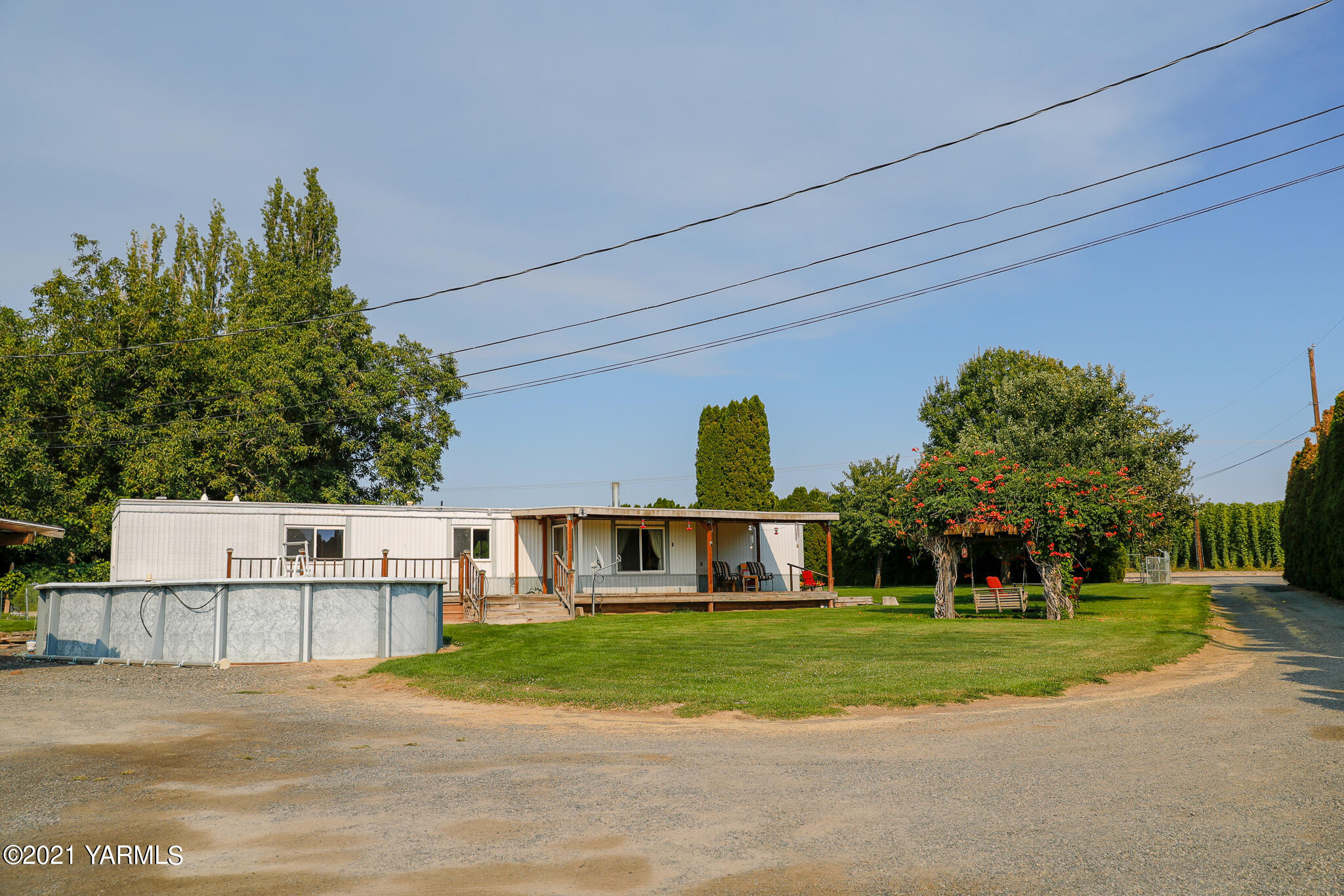 340 Beane Road Moxee, WA 98936 - Photo 3 of 30 a front view of a house with a yard and trees