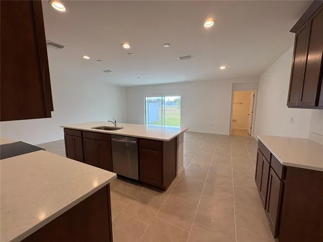 a kitchen with a sink and a refrigerator