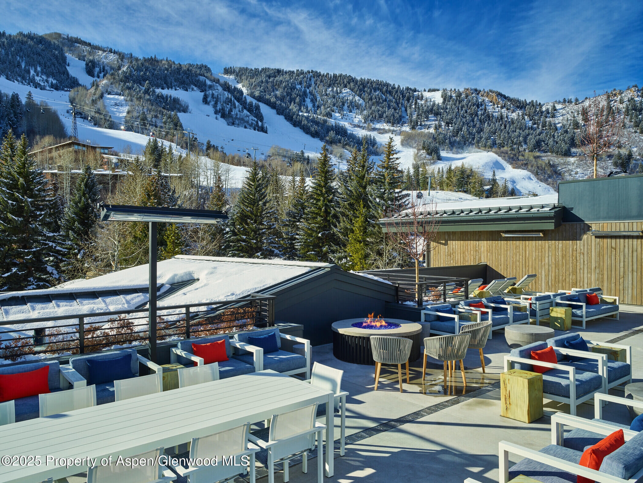 550 South Spring Street Aspen, CO 81611 - Photo 3 of 5 a roof deck with table and chairs