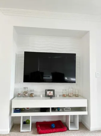 a bathroom with a sink and a microwave