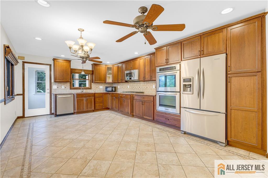5 Montview Road Edison, NJ 08837 - Photo 12 of 47 a large kitchen with stainless steel appliances granite countertop a refrigerator and a sink