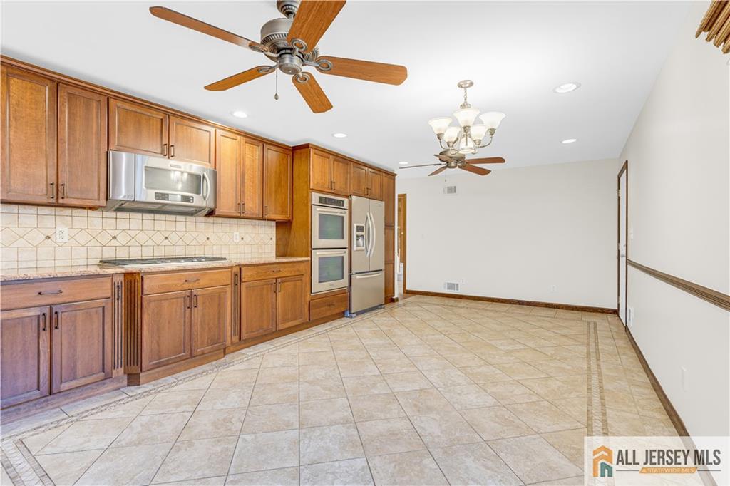 5 Montview Road Edison, NJ 08837 - Photo 16 of 47 a view of a kitchen with a sink and cabinet
