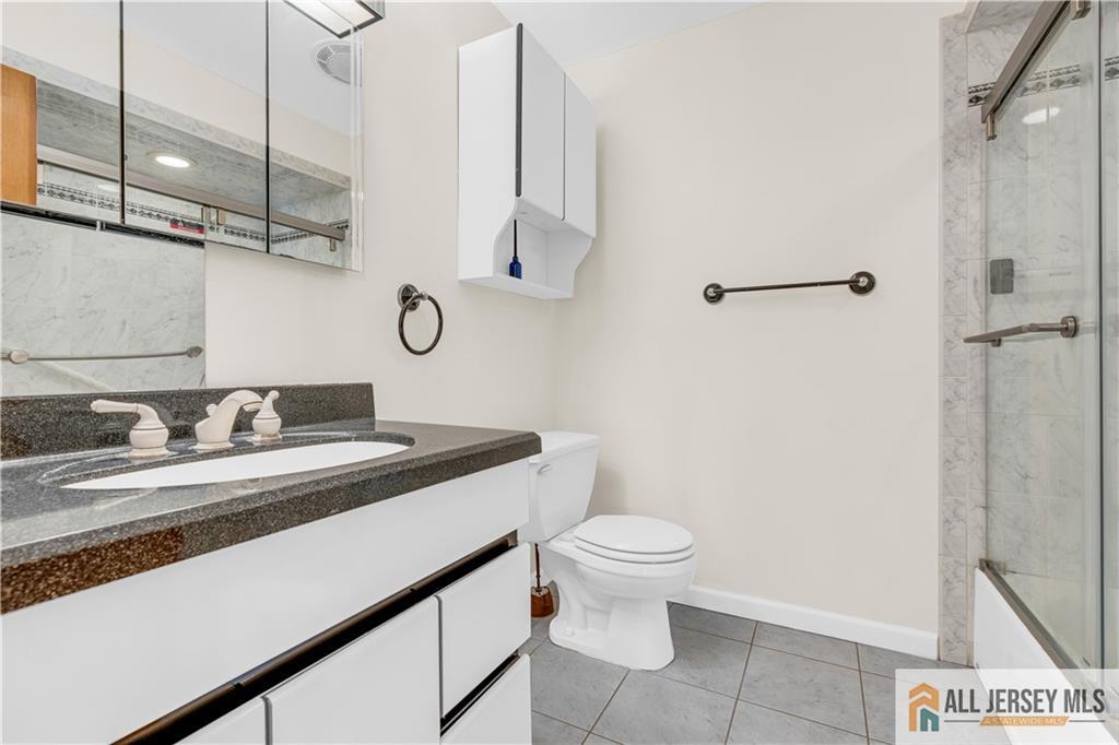 5 Montview Road Edison, NJ 08837 - Photo 19 of 47 a bathroom with a sink a toilet and shower
