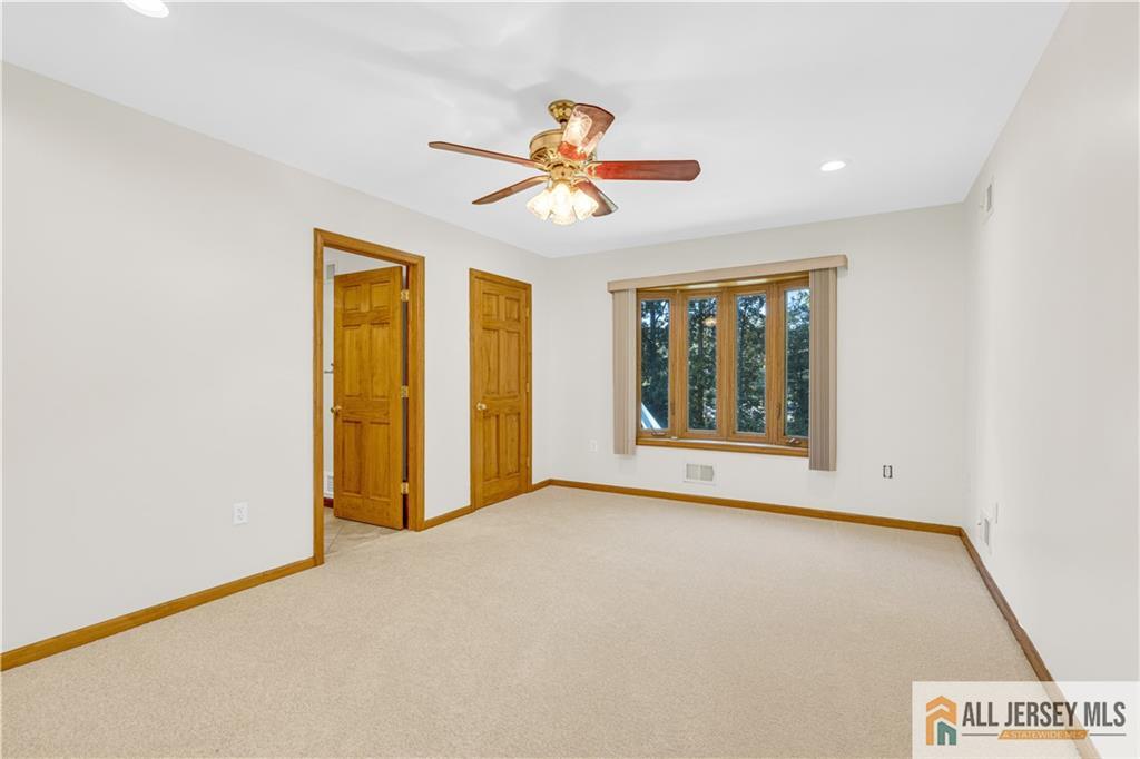 5 Montview Road Edison, NJ 08837 - Photo 20 of 47 a view of an empty room with chandelier fan and window