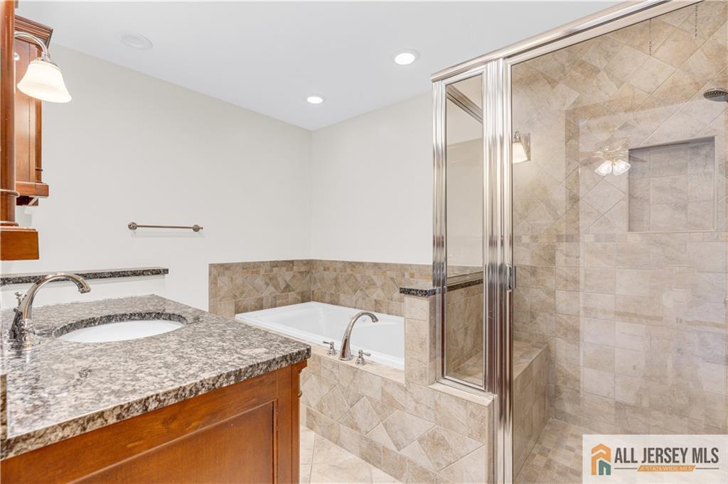 5 Montview Road Edison, NJ 08837 - Photo 23 of 47 a bathroom with a granite countertop sink and a mirror