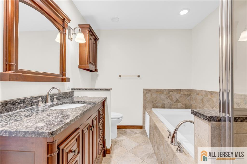 5 Montview Road Edison, NJ 08837 - Photo 24 of 47 a bathroom with a granite countertop double vanity sink and mirror