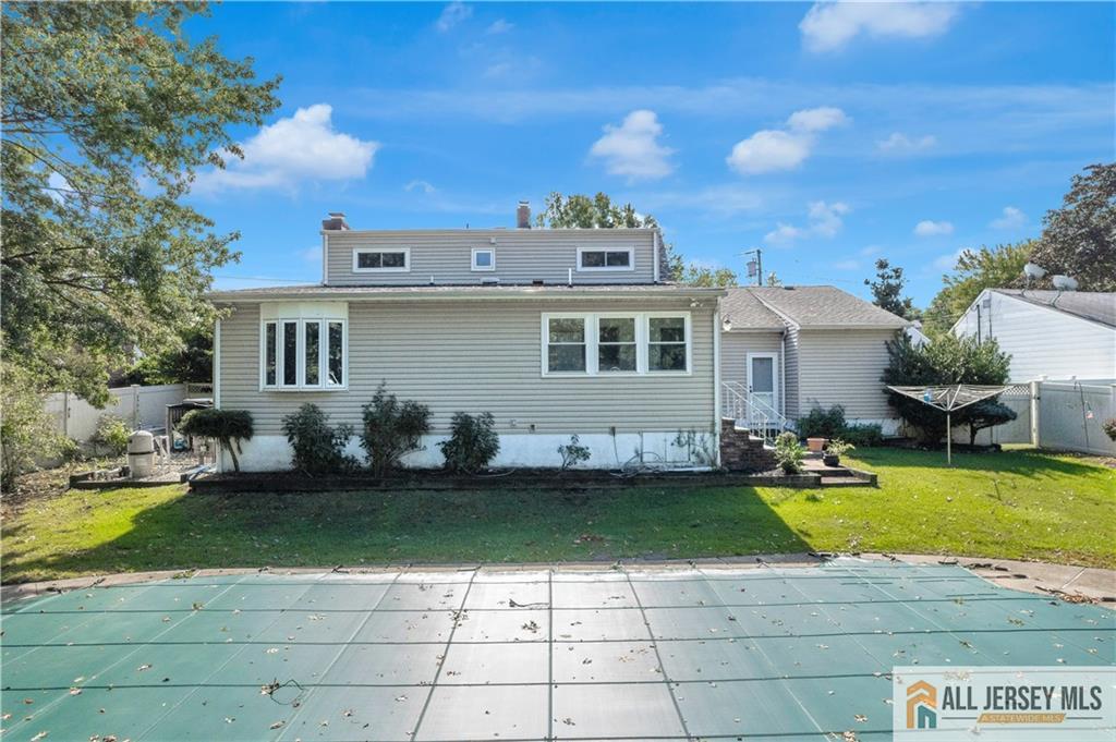 5 Montview Road Edison, NJ 08837 - Photo 40 of 47 a view of a house with swimming pool and yard with furniture