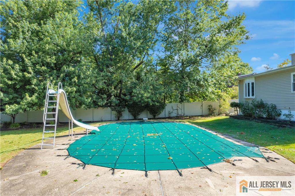 5 Montview Road Edison, NJ 08837 - Photo 43 of 47 a view of a swimming pool with a patio and a yard