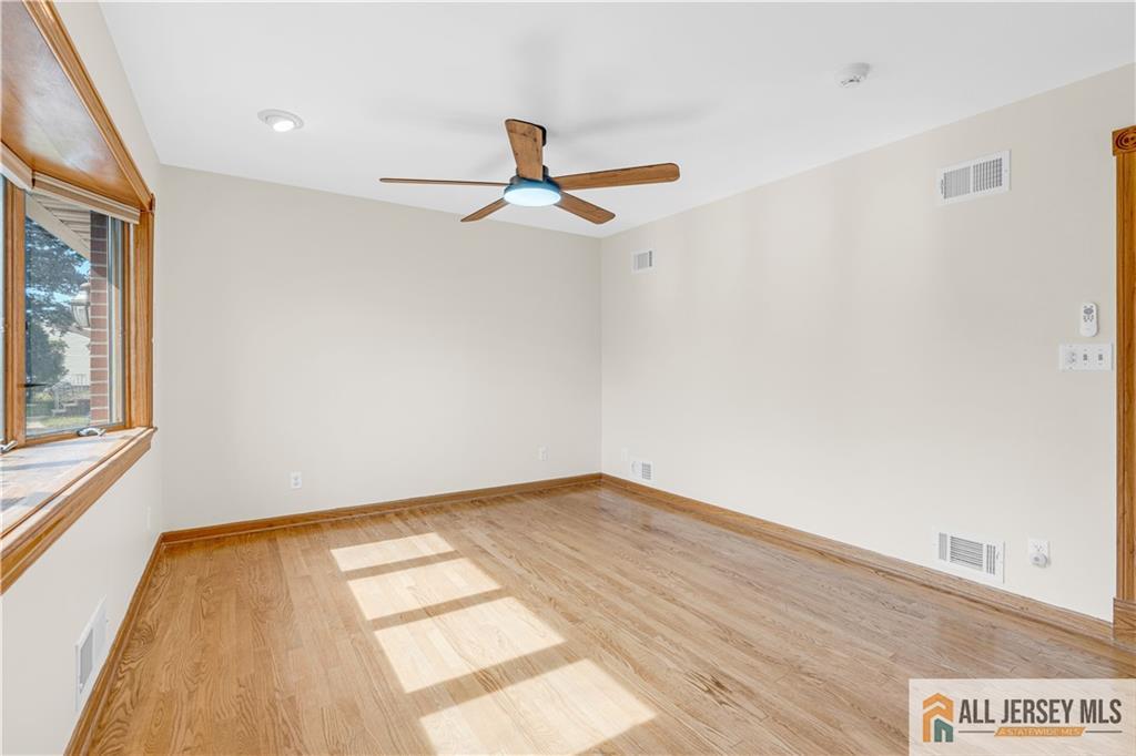 5 Montview Road Edison, NJ 08837 - Photo 5 of 47 a view of empty room with wooden floor and fan