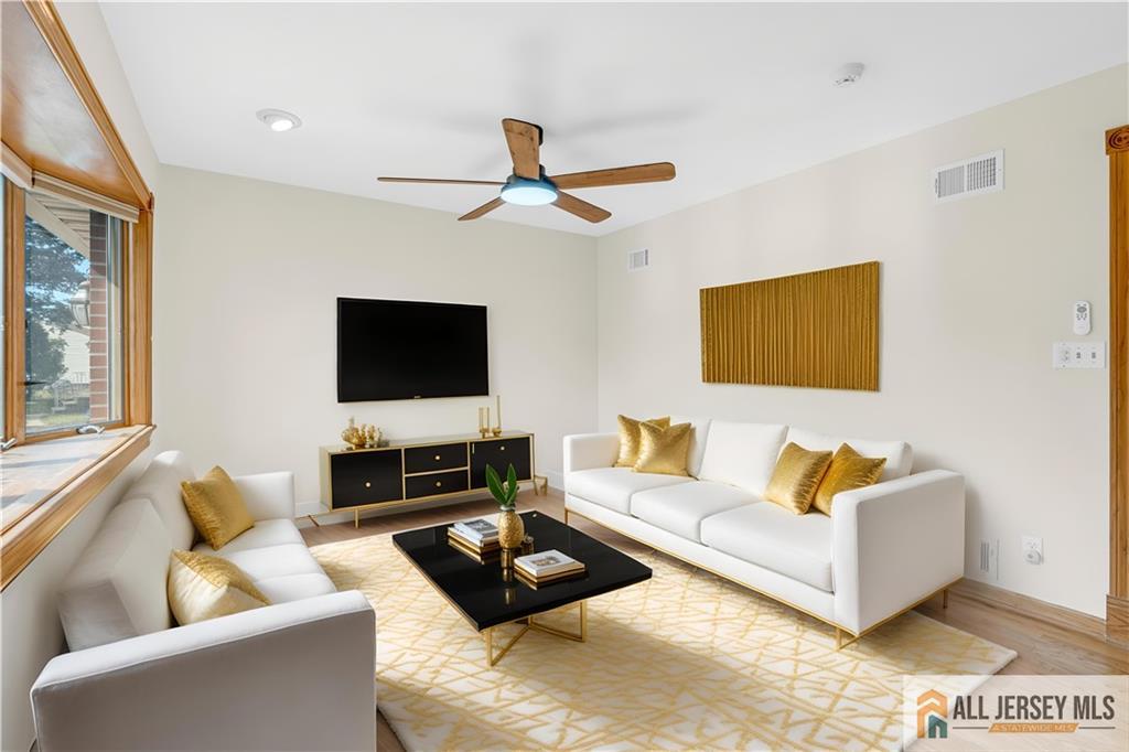 5 Montview Road Edison, NJ 08837 - Photo 6 of 47 a living room with furniture and a flat screen tv