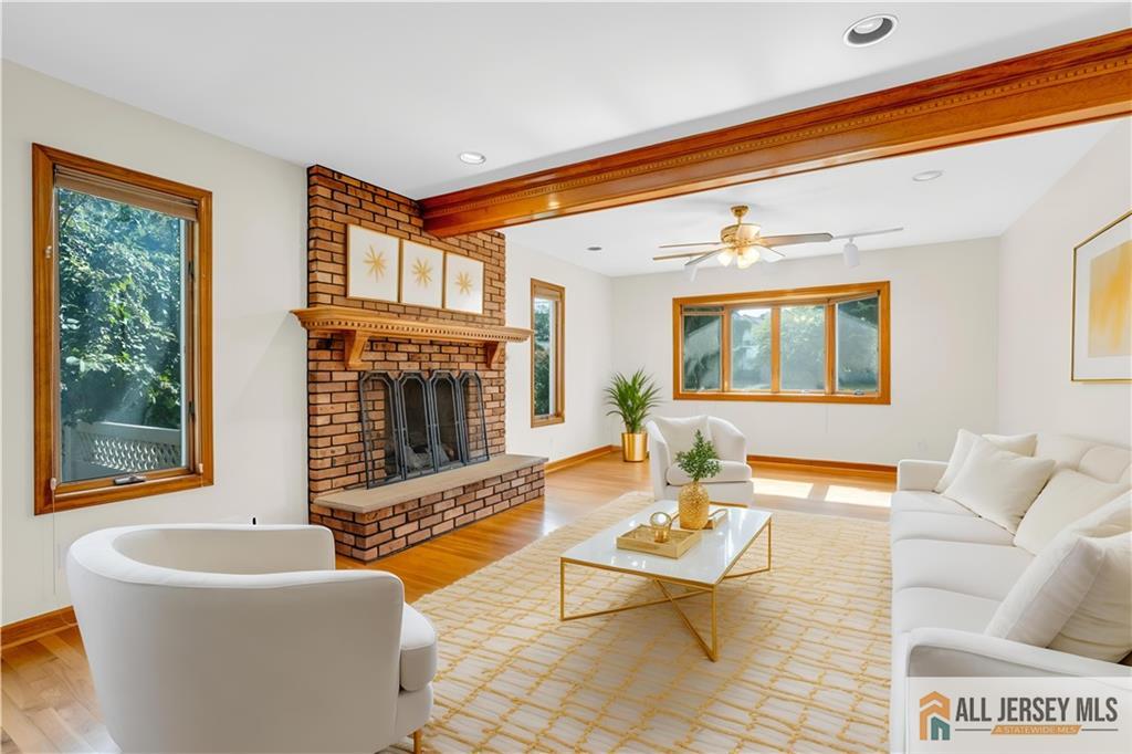 5 Montview Road Edison, NJ 08837 - Photo 8 of 47 a living room with furniture a fireplace and a flat screen tv