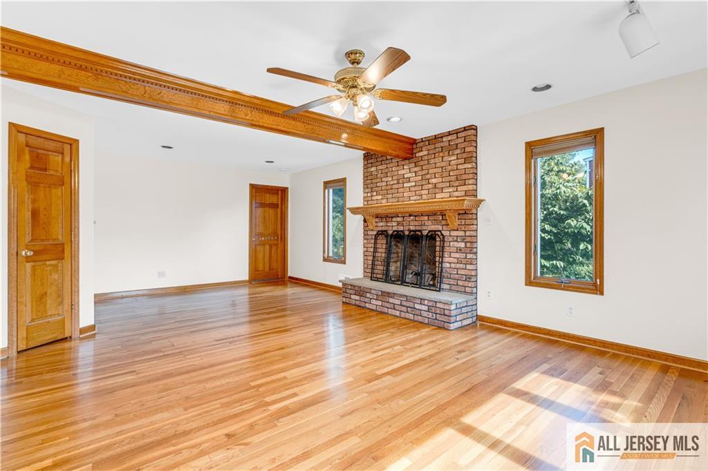 5 Montview Road Edison, NJ 08837 - Photo 10 of 47 a view of empty room with wooden floor and fireplace