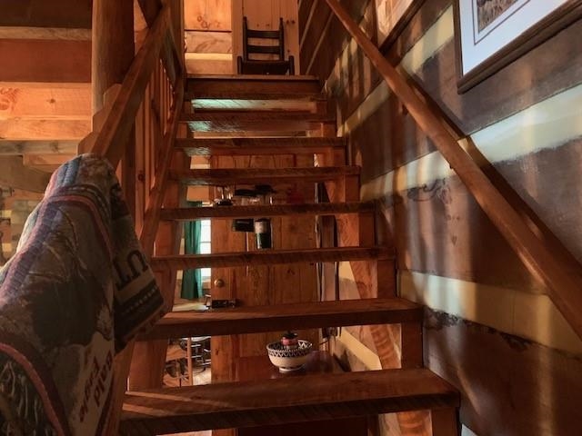 2677 Sounding Knob Road Monterey, VA 24465 - Photo 10 of 22 a view of staircase with lots of frames on wall and a window