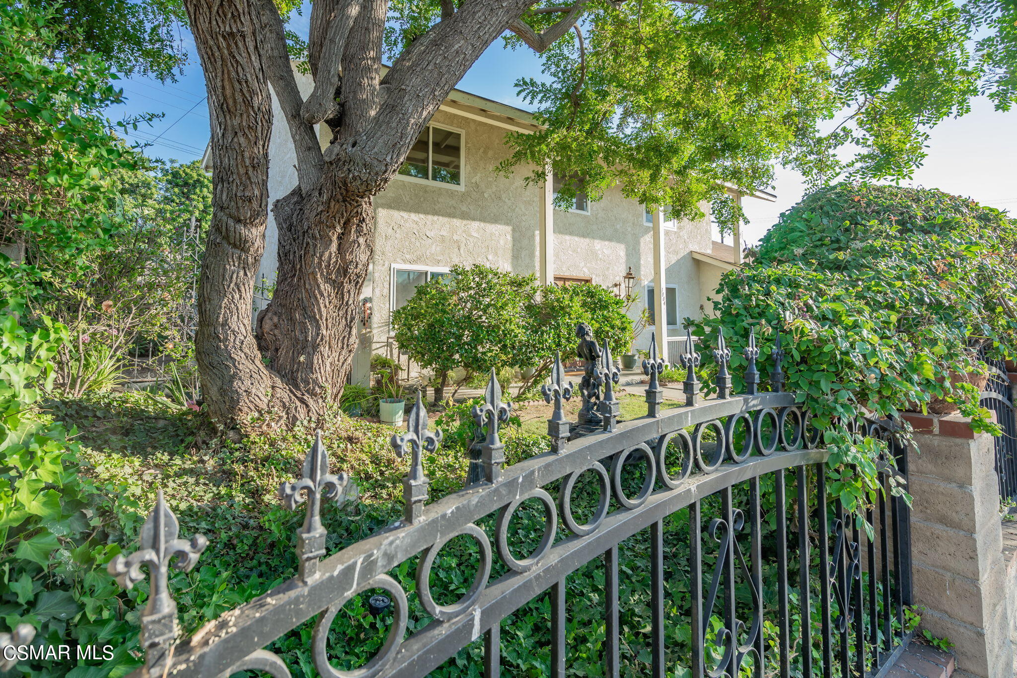 3004 Fitzgerald Road Simi Valley, CA 93065 - Photo 3 of 35 a view of a house with a tree in front of it