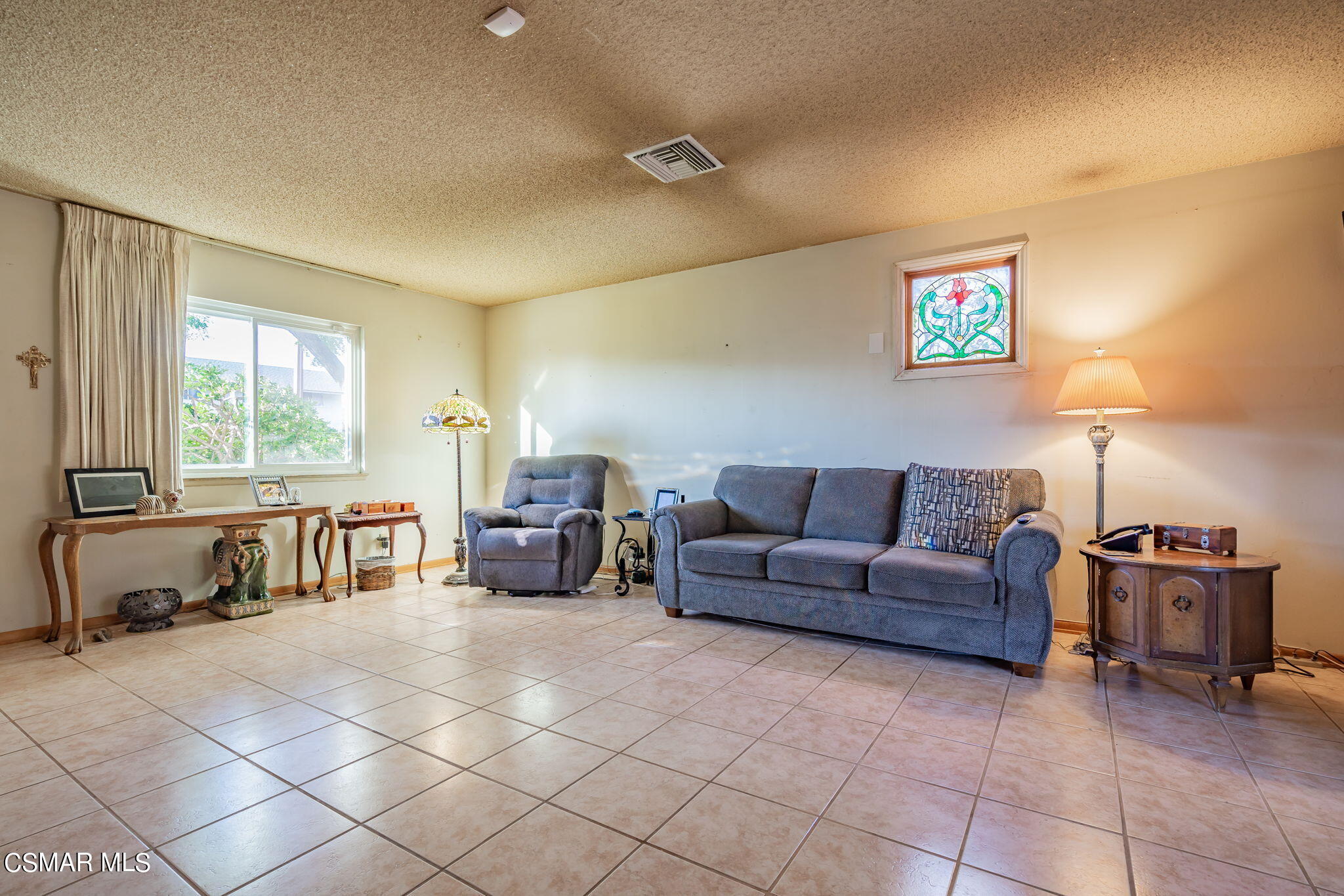 3004 Fitzgerald Road Simi Valley, CA 93065 - Photo 8 of 35 a living room with furniture and a flat screen tv
