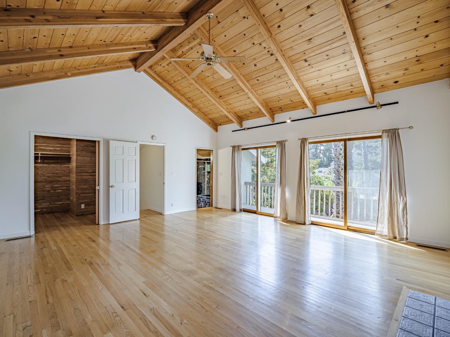 1459 High Street Santa Cruz, CA 95060 - Photo 18 of 62 a view of an empty room with wooden floor and a window