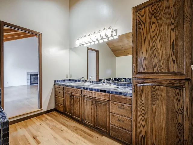 a bathroom with a shower and mirror
