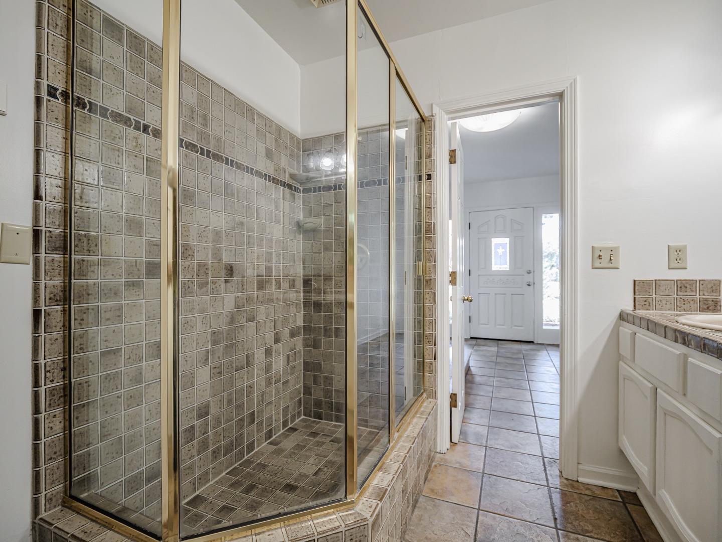 1459 High Street Santa Cruz, CA 95060 - Photo 24 of 62 a bathroom with a shower and mirror