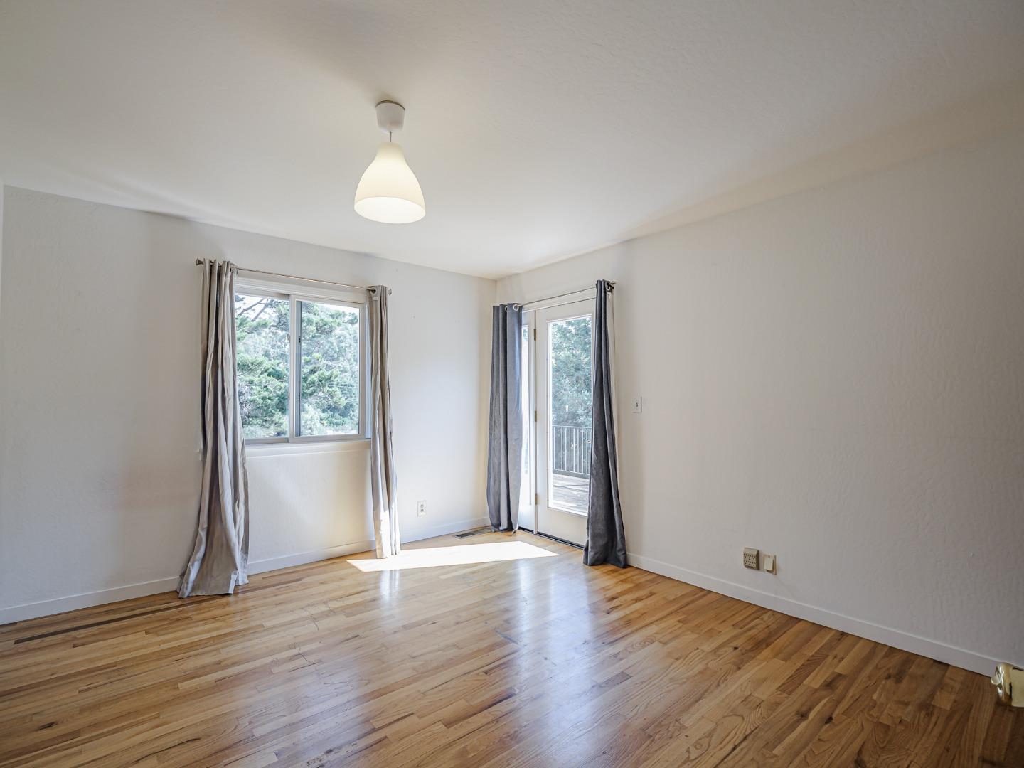 1459 High Street Santa Cruz, CA 95060 - Photo 28 of 62 an empty room with wooden floor and windows