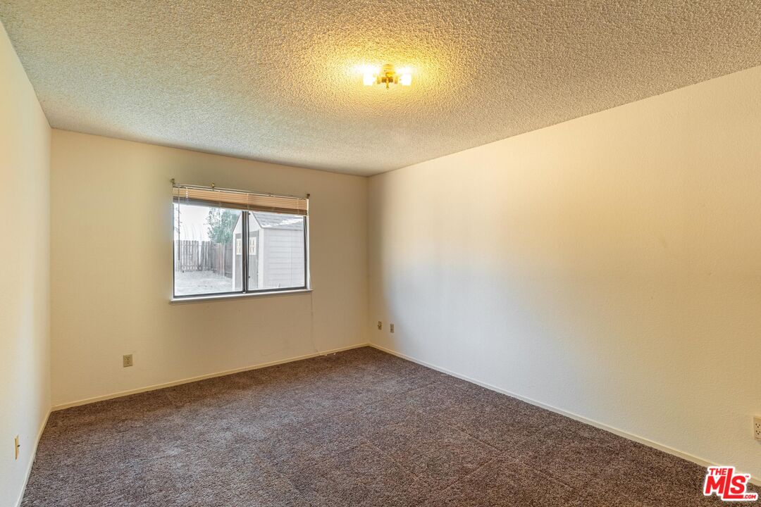 1217 Ave H4 Lancaster, CA 93534 - Photo 11 of 18 an empty room with a window