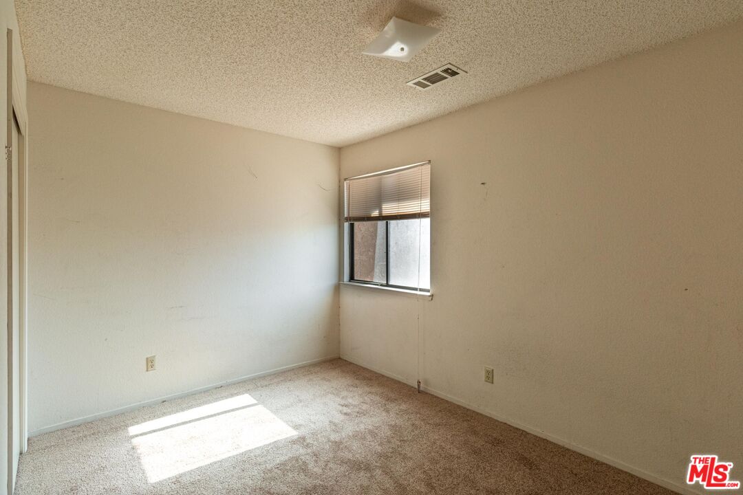 1217 Ave H4 Lancaster, CA 93534 - Photo 13 of 18 an empty room with windows