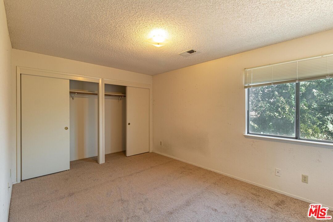 1217 Ave H4 Lancaster, CA 93534 - Photo 15 of 18 an empty room with windows