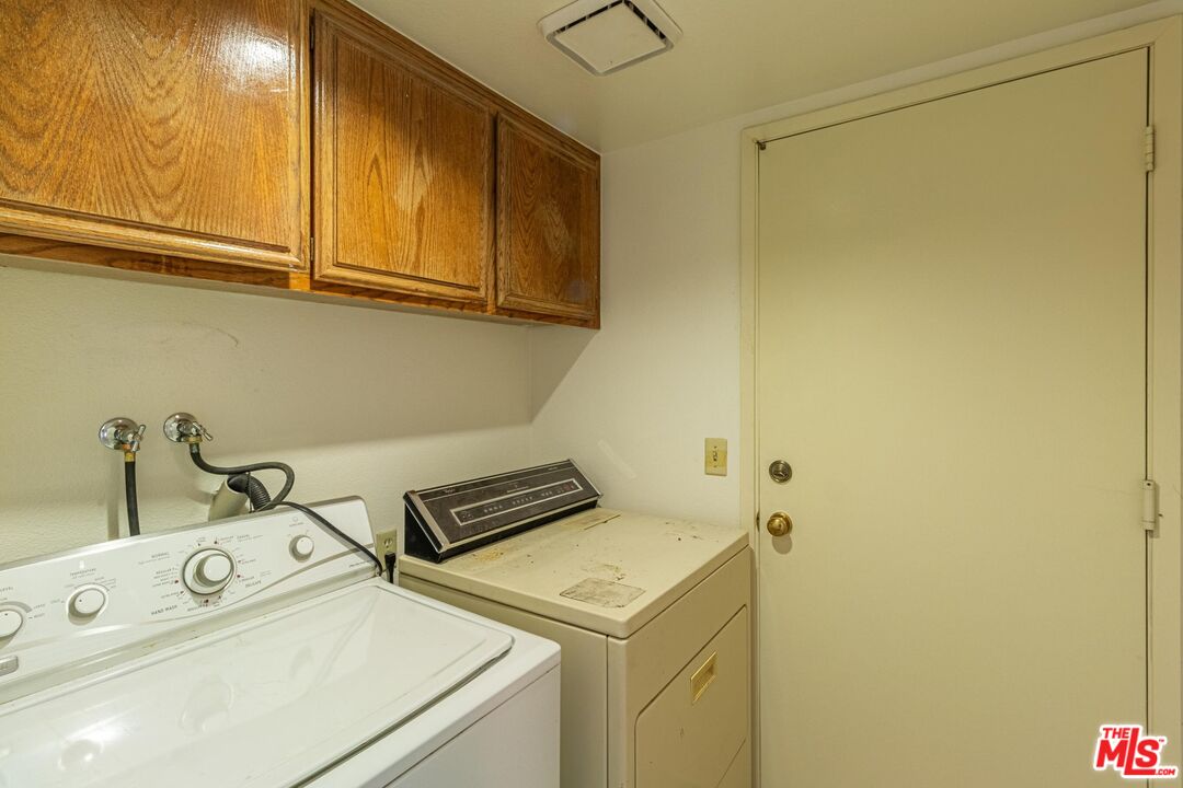 1217 Ave H4 Lancaster, CA 93534 - Photo 7 of 18 a utility room with dryer and washer