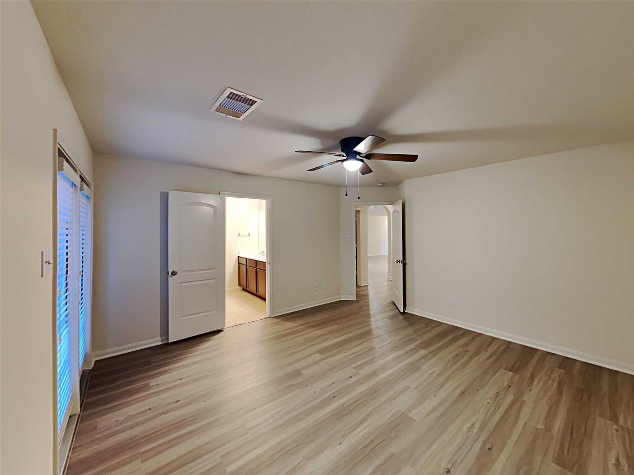 22718 Klingamans Way Hockley, TX 77447 - Photo 12 of 20 a view of an empty room with wooden floor and a window