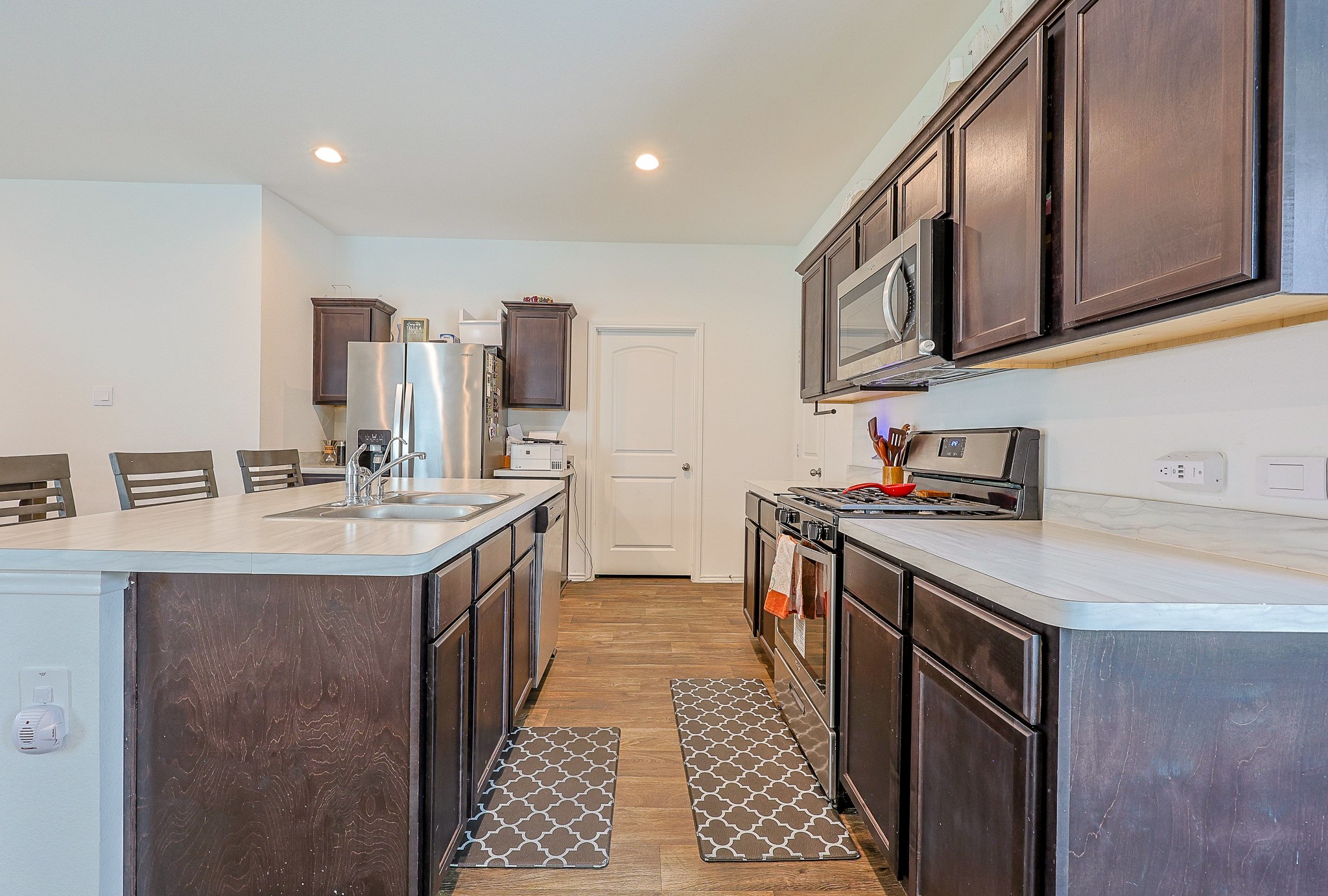 22603 Aspen Tarn Trail Spring, TX 77373 - Photo 3 of 20 a kitchen with stainless steel appliances granite countertop a sink stove and cabinets