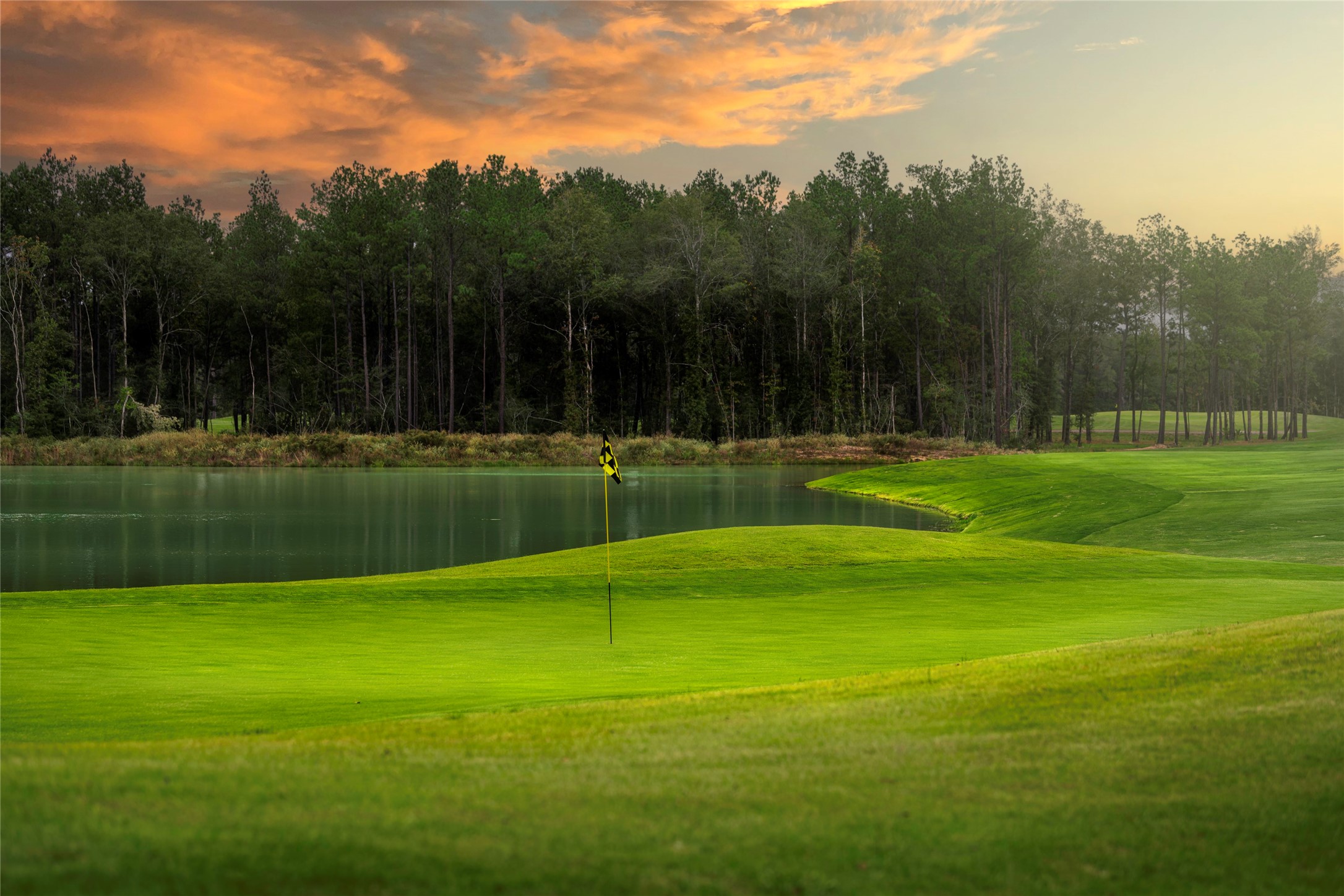 21956 Rolling Grns Road Porter, TX 77365 - Photo 13 of 16 Tee off in a breathtaking natural setting at The Highlands’ scenic golf course—offering lush fairways, serene water views, and a tranquil backdrop for every round.