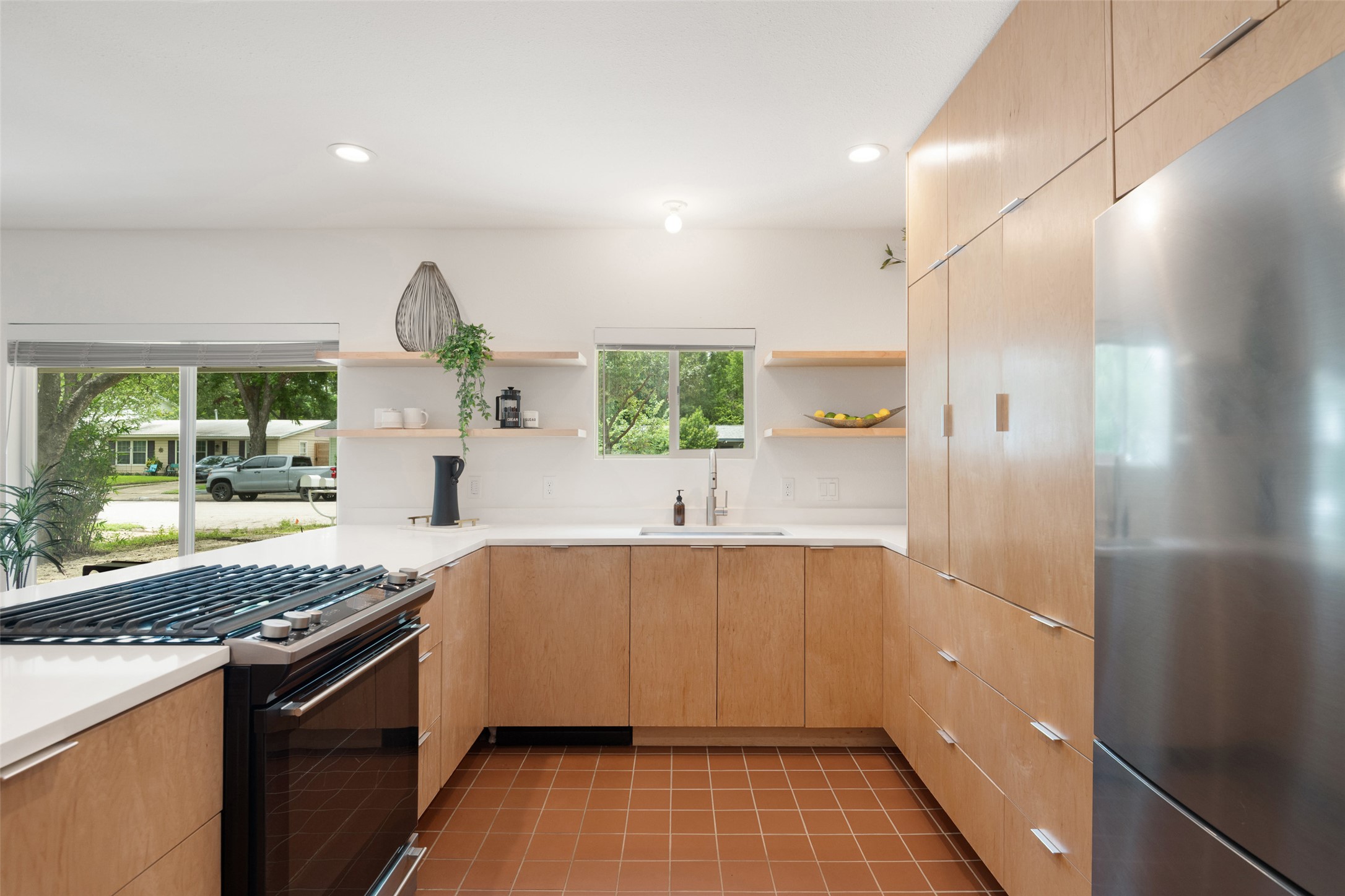 5507 Duval Street, Unit A Austin, TX 78751 - Photo 1 of 1 a kitchen with a sink and a stove top oven