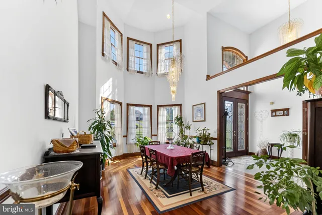 a view of a livingroom with furniture and a hallway