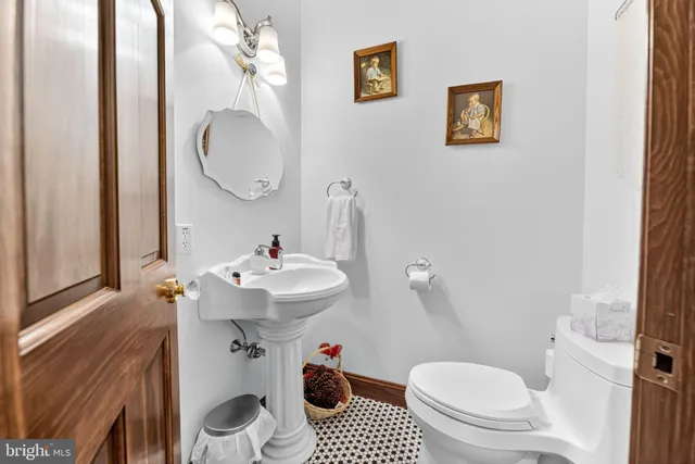 a bed sitting in a bedroom and night stand