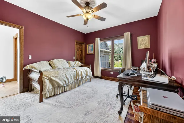 a view of an entryway with wooden floor and front door
