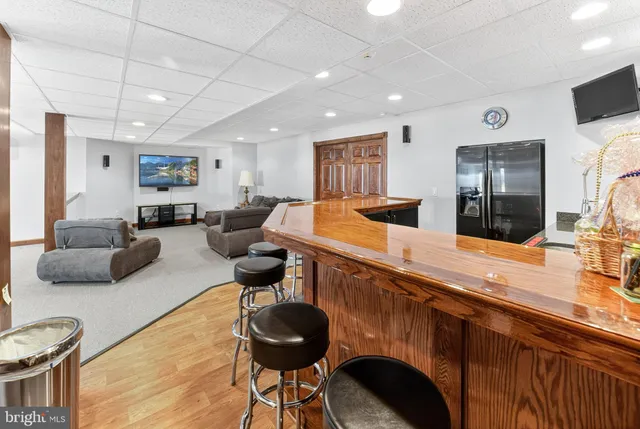 a view of a house with a yard and garage