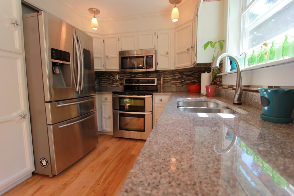 647 Wiswell Road Holden, ME 04429 - Photo 2 of 35 Cabinets offer plenty of storage space.